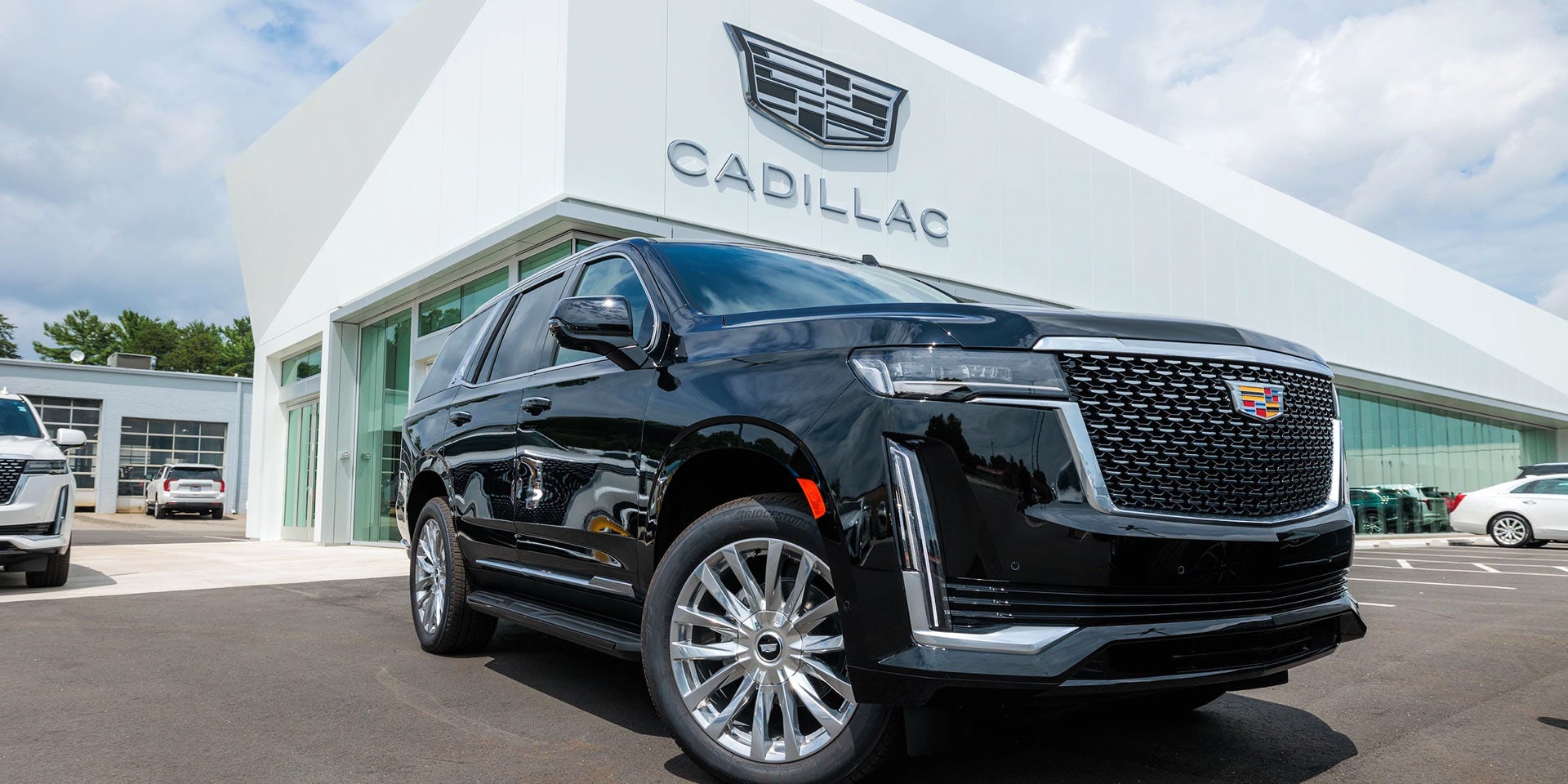 A cadillac car parked outside Flow Cadillac showroom